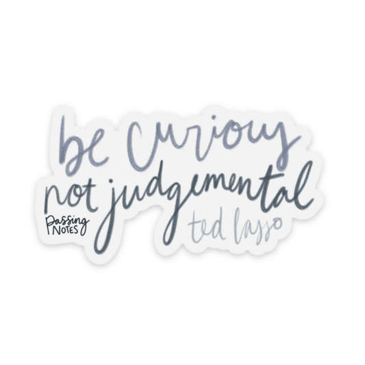 Clear backed stickers that says "be curious not judgemental" by ted lasso, in varied medium blue handwritten fonts