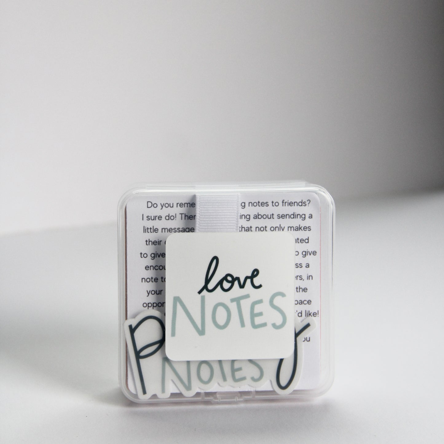 A small, transparent box contains several note cards that you can pass to your loved ones. "Love Notes," is elegantly written in cursive on the box, expressing that the theme of this box is Love themed.
