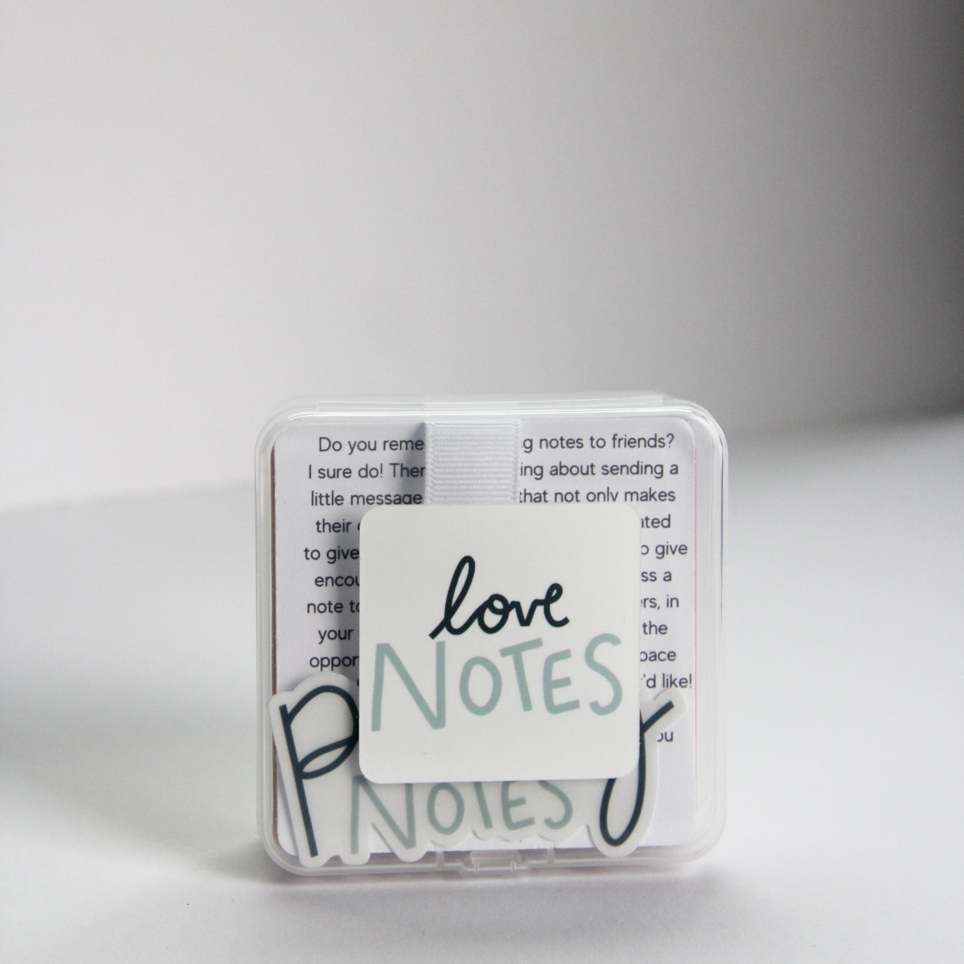 A small, transparent box contains several note cards that you can pass to your loved ones. "Love Notes," is elegantly written in cursive on the box, expressing that the theme of this box is Love themed.