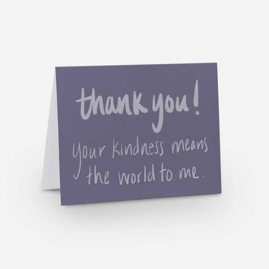 A2 horizontal sized card with a medium purple background and light purple handwritten font that says "thank you! your kindness means the world to me"