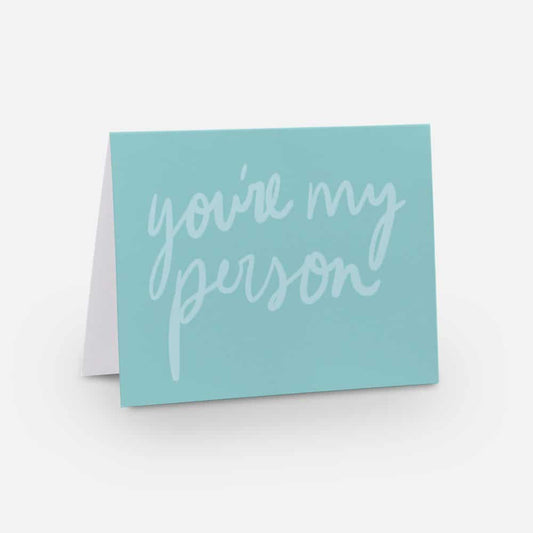 A2 horizontal sized card with a robin egg's blue background and light blue handwritten font that says "you're my person"