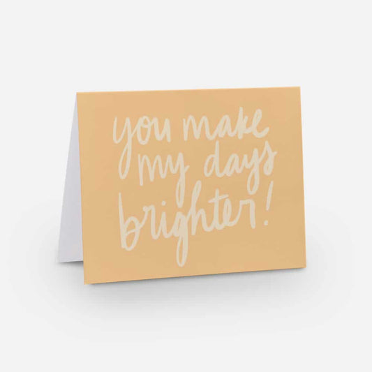 A2 sized horizontal card with a golden yellow background and white font that says "you make my days brighter!" in handwritten font