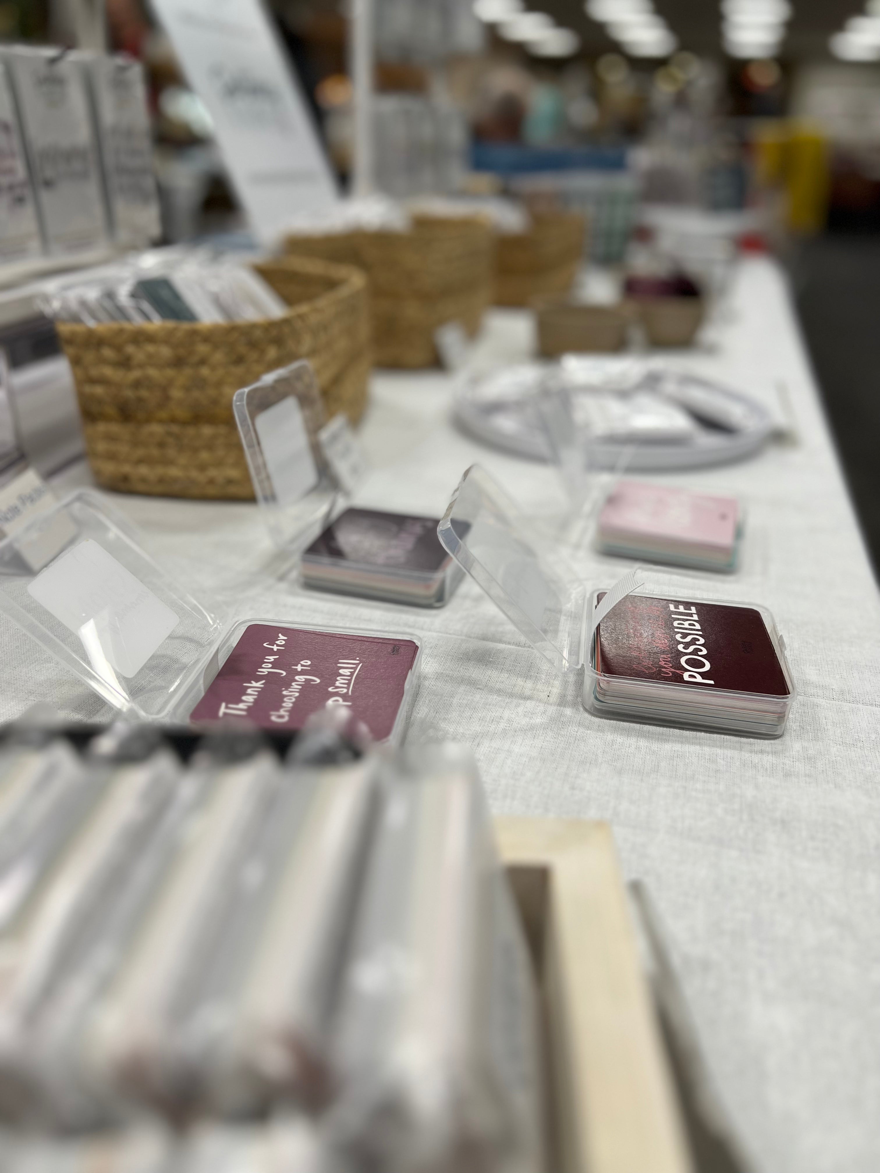 Photo of Note Packs on a table, open for people to peruse at local events