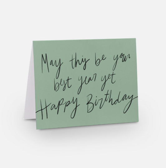 A2 sized horizontal card with a light green background and black handwritten font that says "may this be your best year yet happy birthday" 
