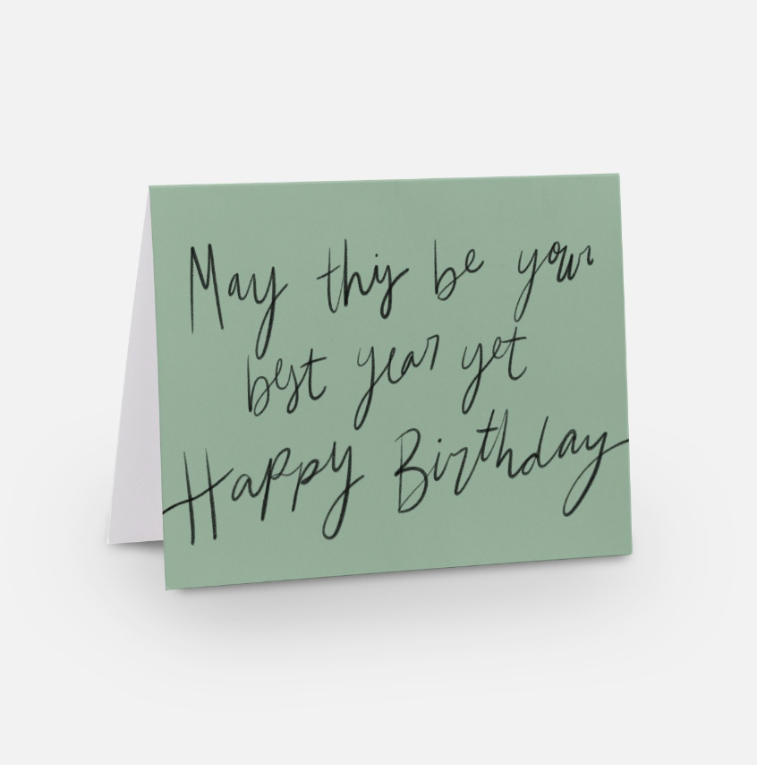 A2 sized horizontal handwritten birthday card with a light green background and black handwritten font that says "may this be your best year yet happy birthday" 