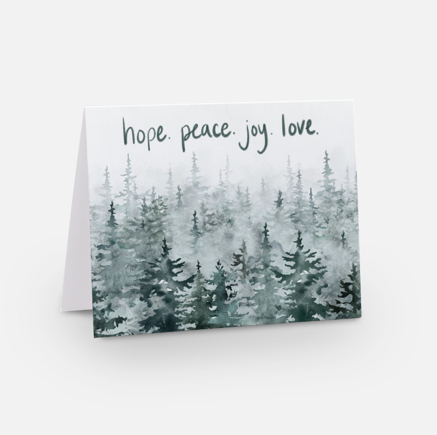 A holiday greeting card showcasing unique artwork with a watercolor forest scene of evergreen trees. The text "hope. peace. joy. love." in cursive graces the top against a crisp white background, making it perfect for sharing personalized messages this holiday season.